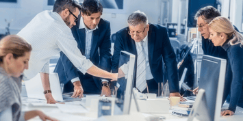 a business meeting taking place inside an office