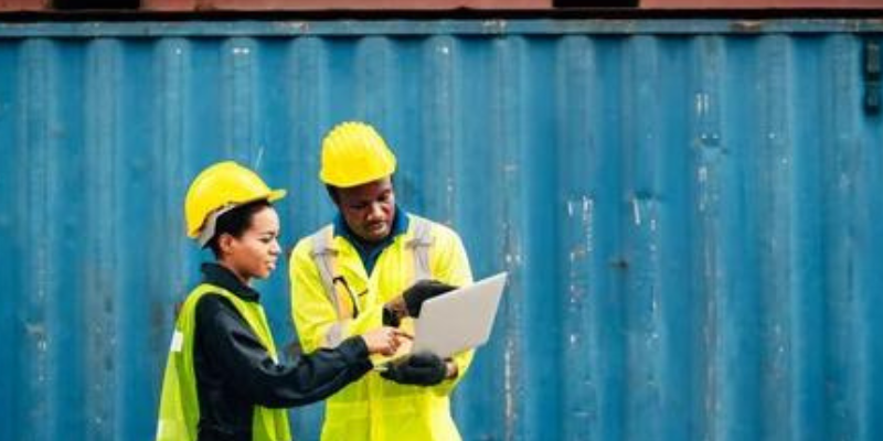 Two people against a blue backdrop